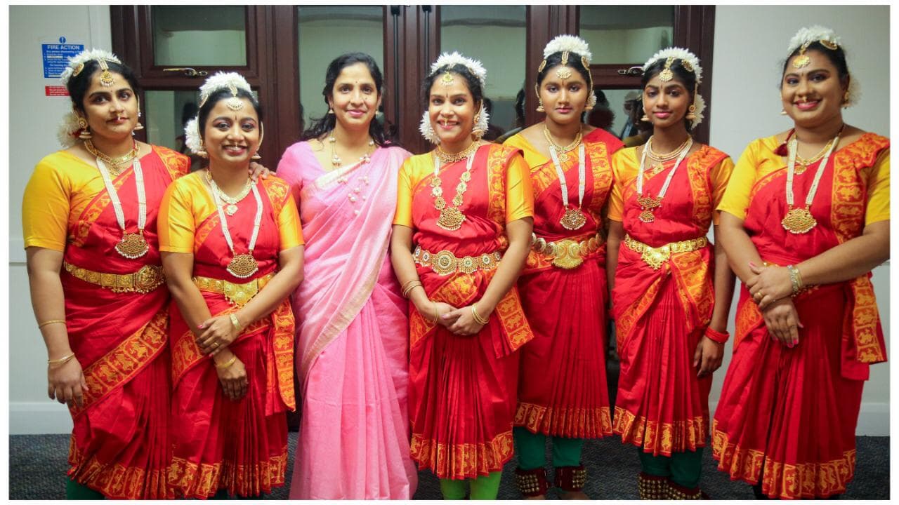 Smt. Shruthi Raghavendra with students in classical dance costumes